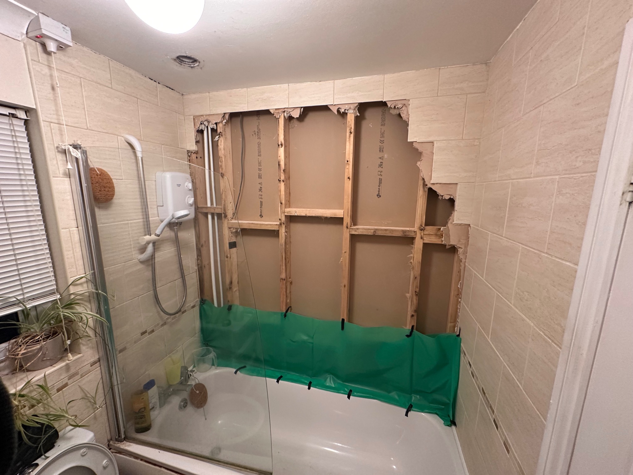 Bathroom with new moisture-resistant boards installed during refurbishment