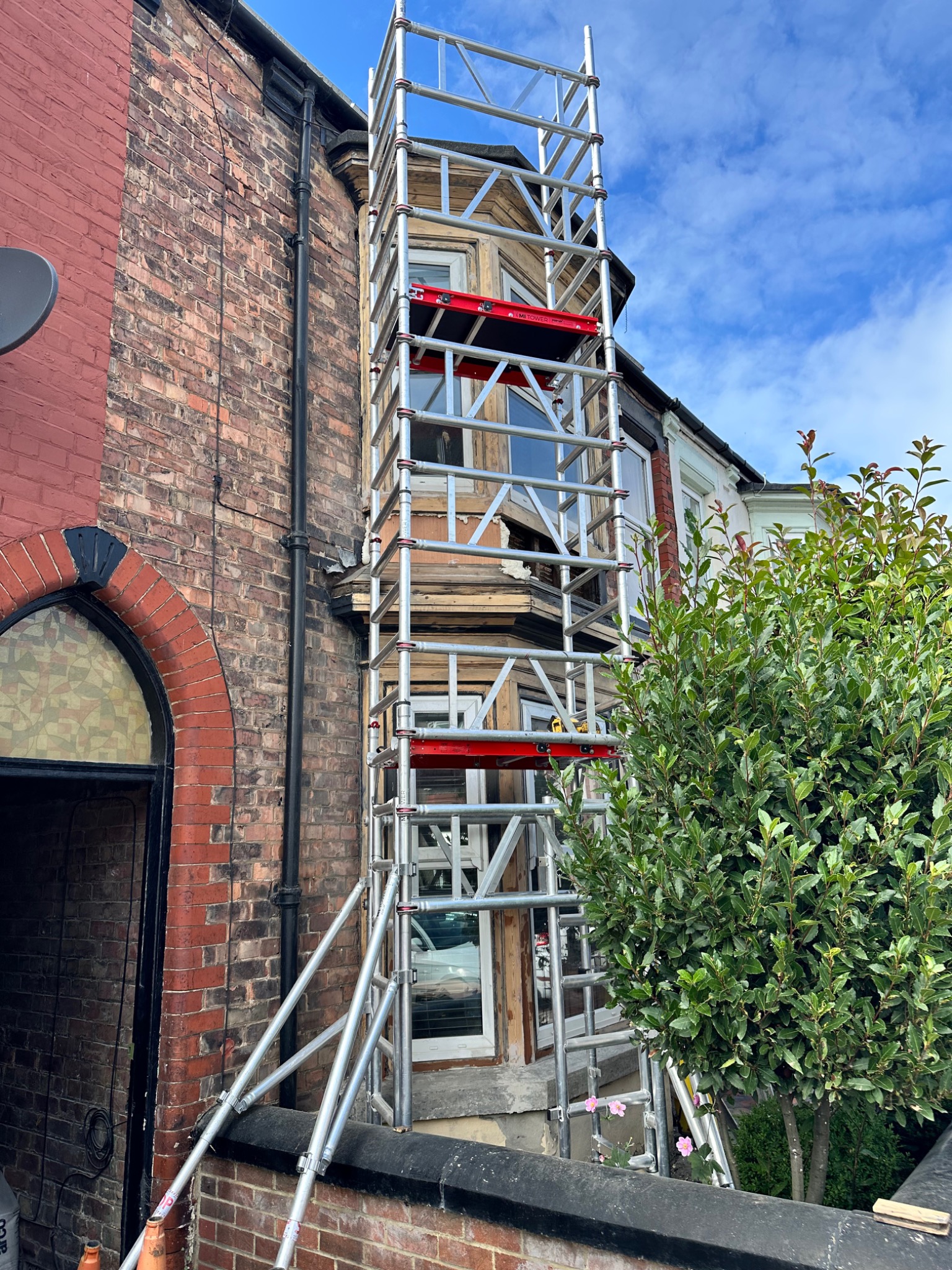 Victorian double bay window restoration with access scaffold in place
